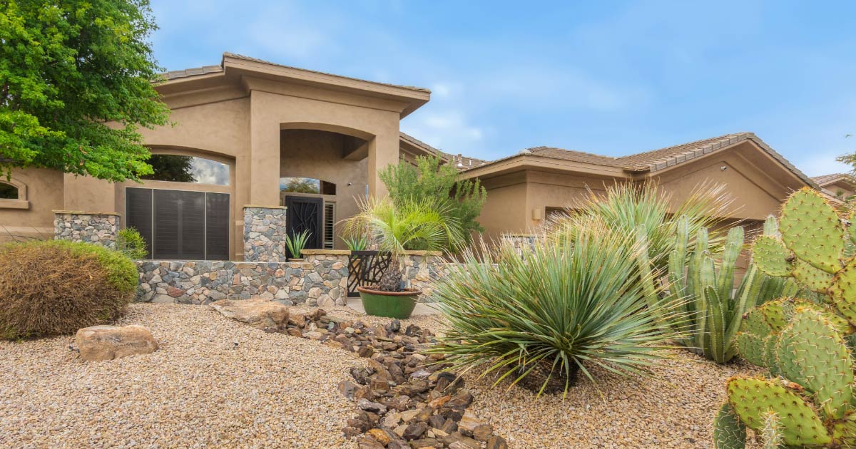 Luxurious home in Cave Creek with clay tile roof and desert landscaping