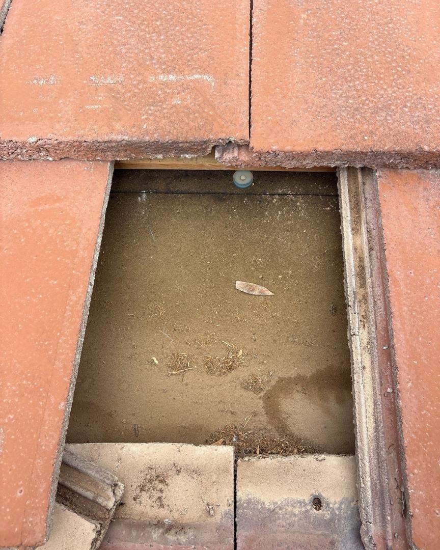 Aged underlayment failure beneath tile roof in Phoenix Arizona