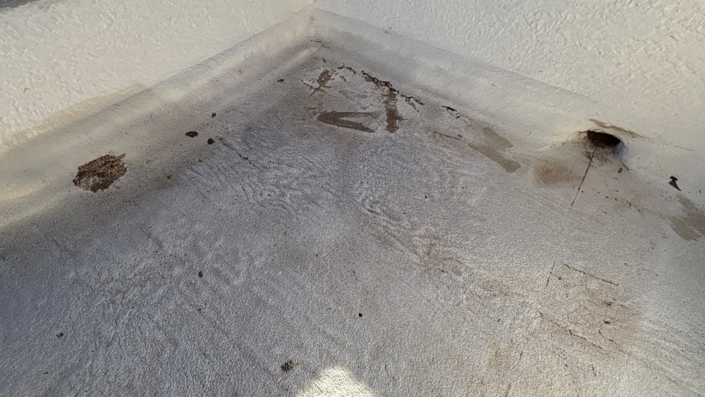 Worn roof coating and UV damage on Phoenix foam roof showing signs of needed repair