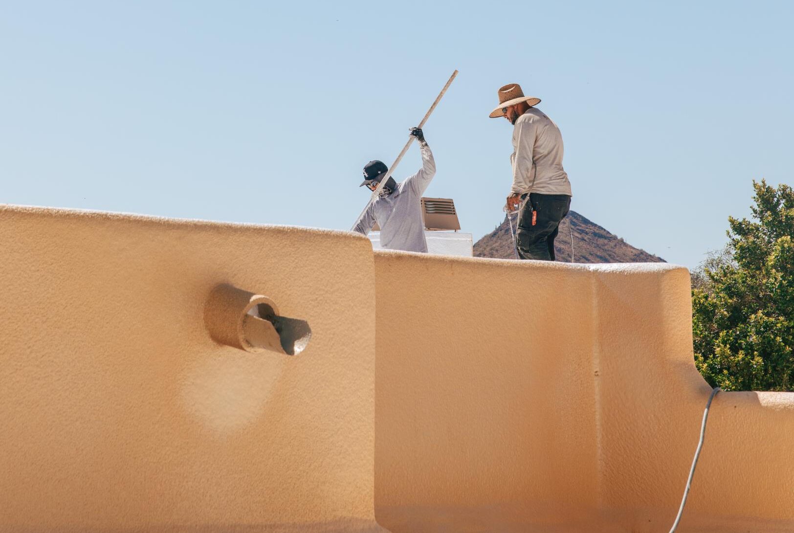 RENCO Roofing Team works on a roof coating project in Phoenix AZ