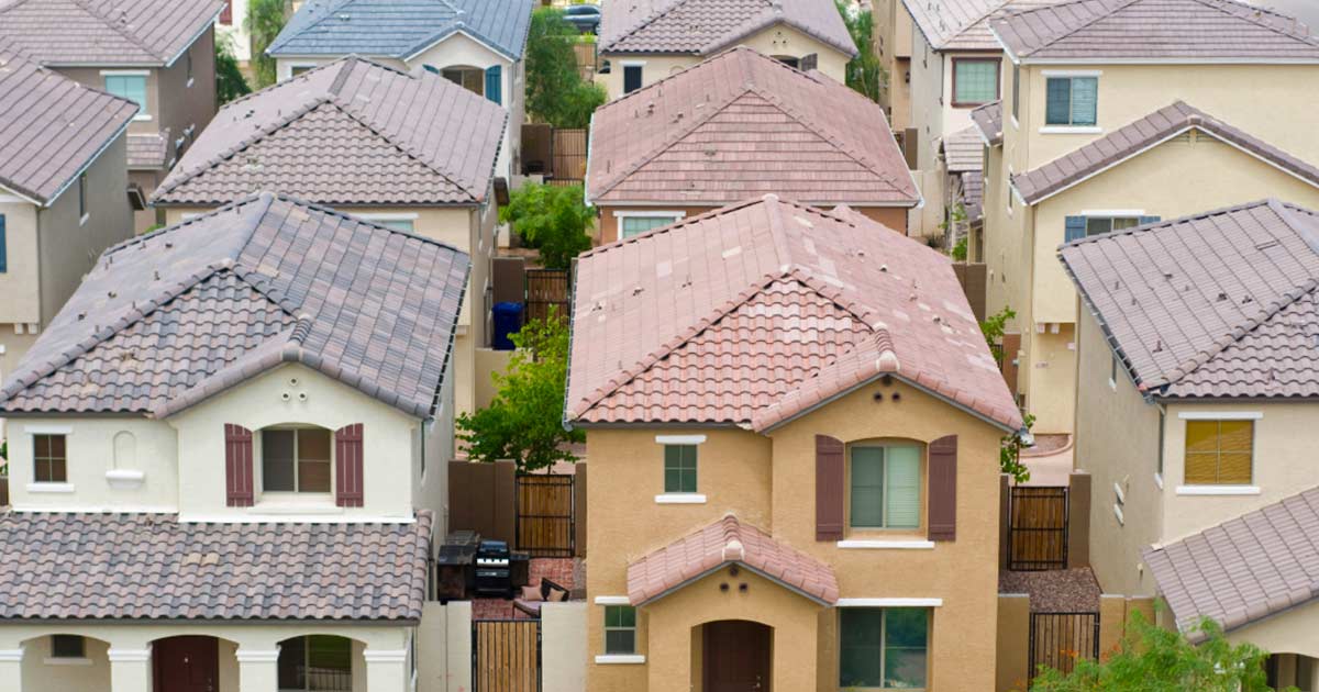 Row of two story homes with tile roofs in Gilbert