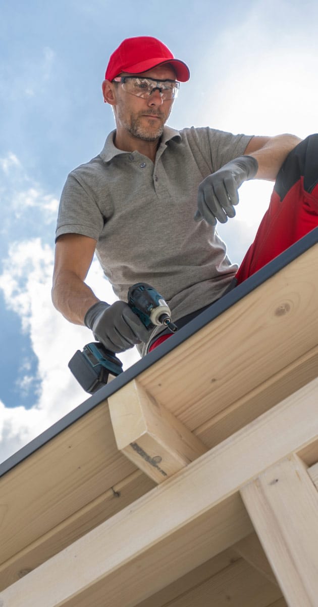 Roofing expert conducting repairs on Peoria house roof